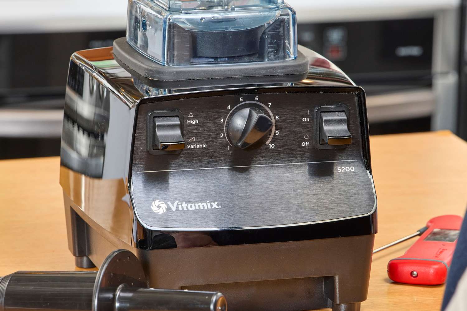 A close-up of the bottom of the Vitamix 5200 Professional-Grade Blender on a wooden surface