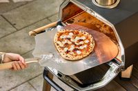 A pizza cooked in the Ooni Karu 2 Pro Multi-Fuel Pizza Oven