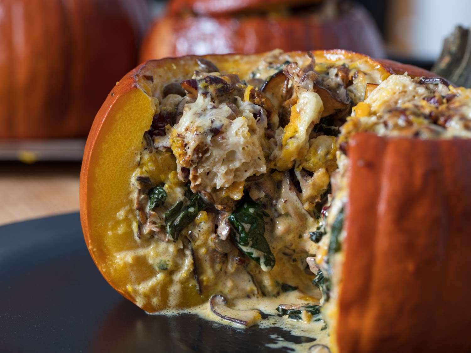 Stuffed pumpkins with Gruyere, mushrooms, kale (for Thanksgiving and holidays), cross section beauty shot.