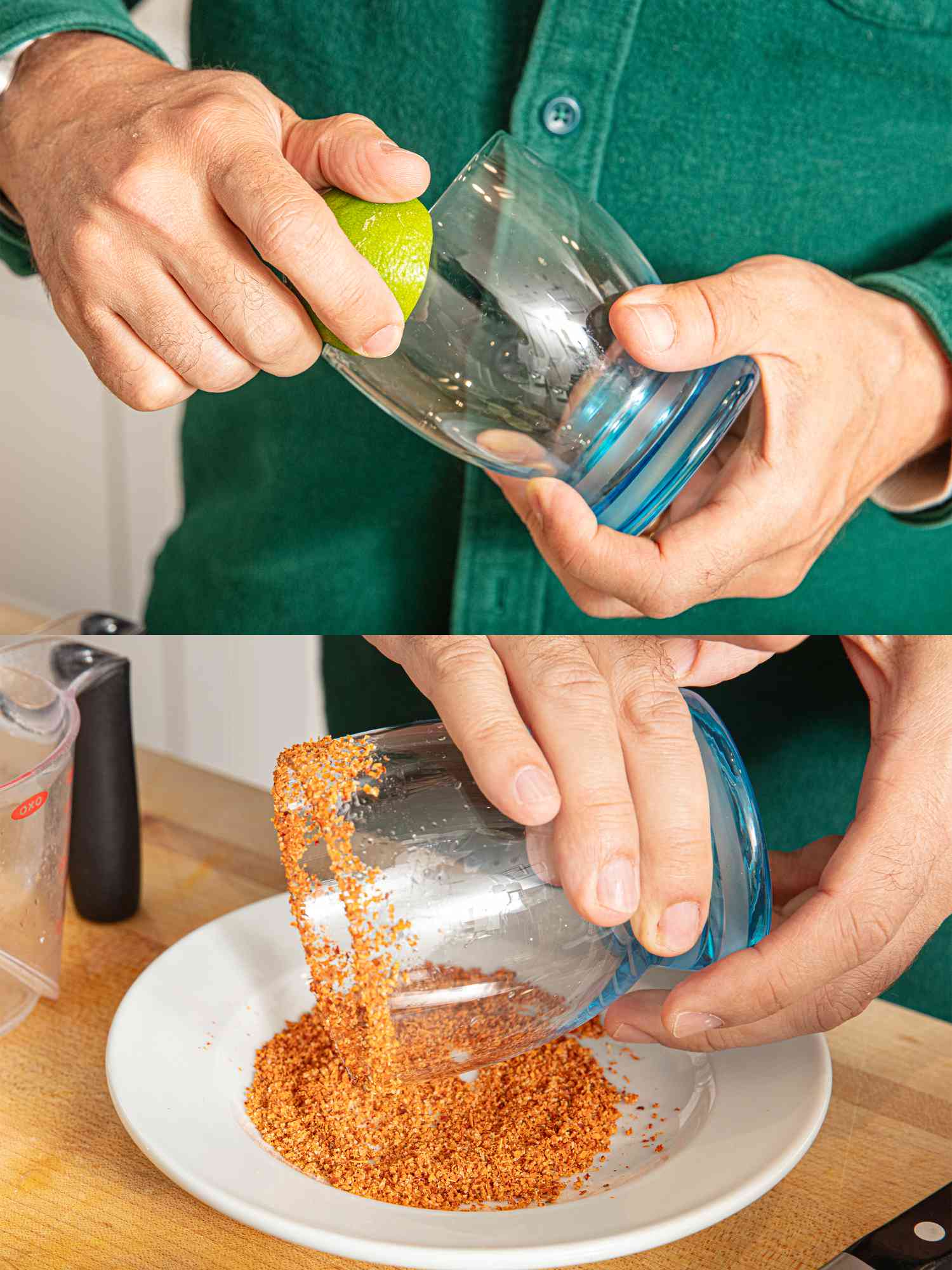 A person preparing a glass rim with lime juice and dipping it in tajin mixture