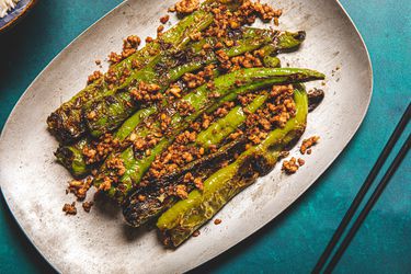 Tiger peppers on a serving platter with ground pork