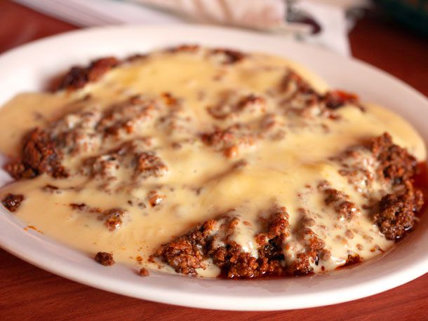 Closeup of choriqueso, served in a shallow bowl.