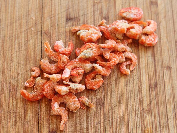 Dried shrimp on a cutting board. 
