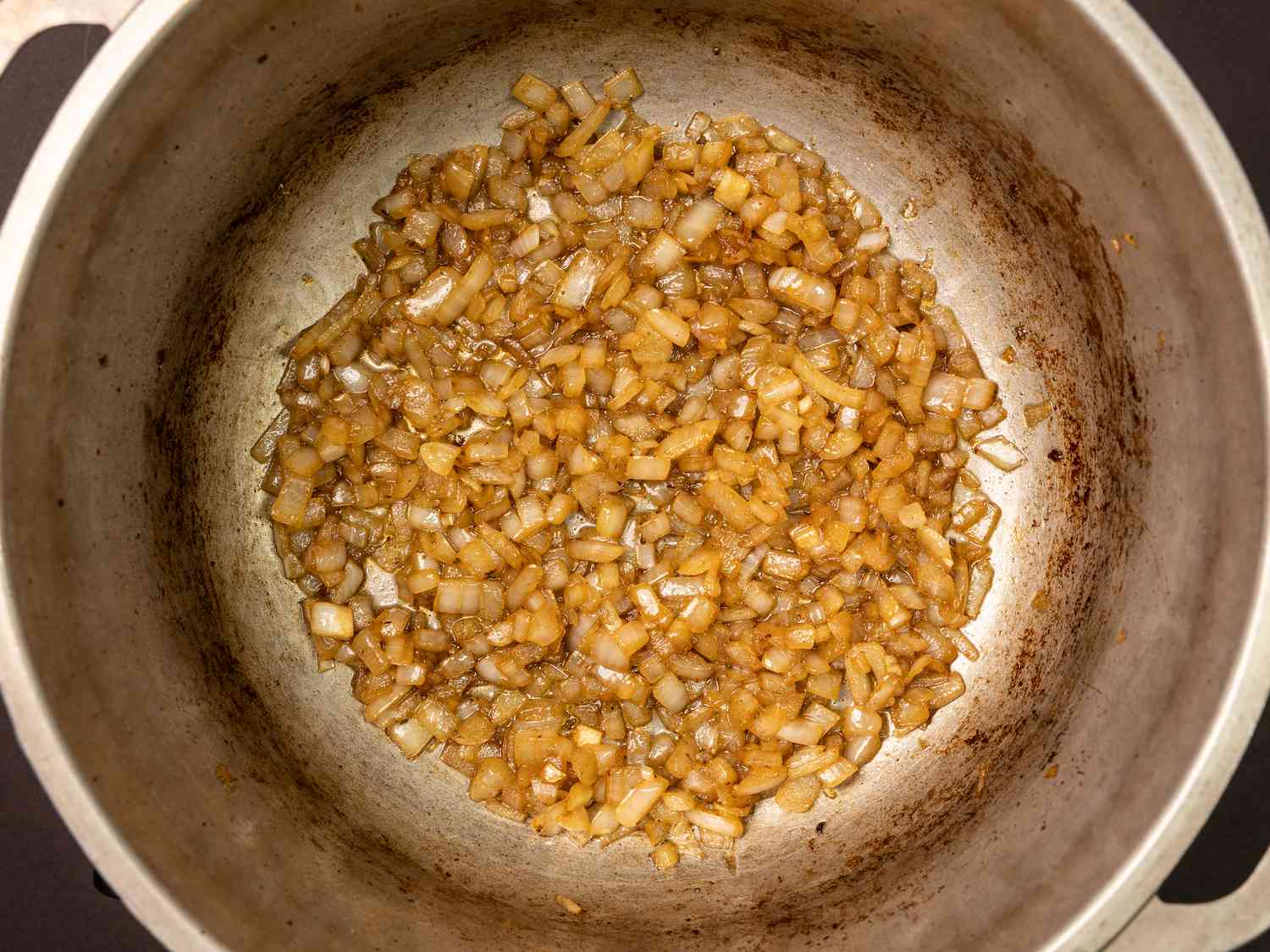 Chopped onions cooking in pot 