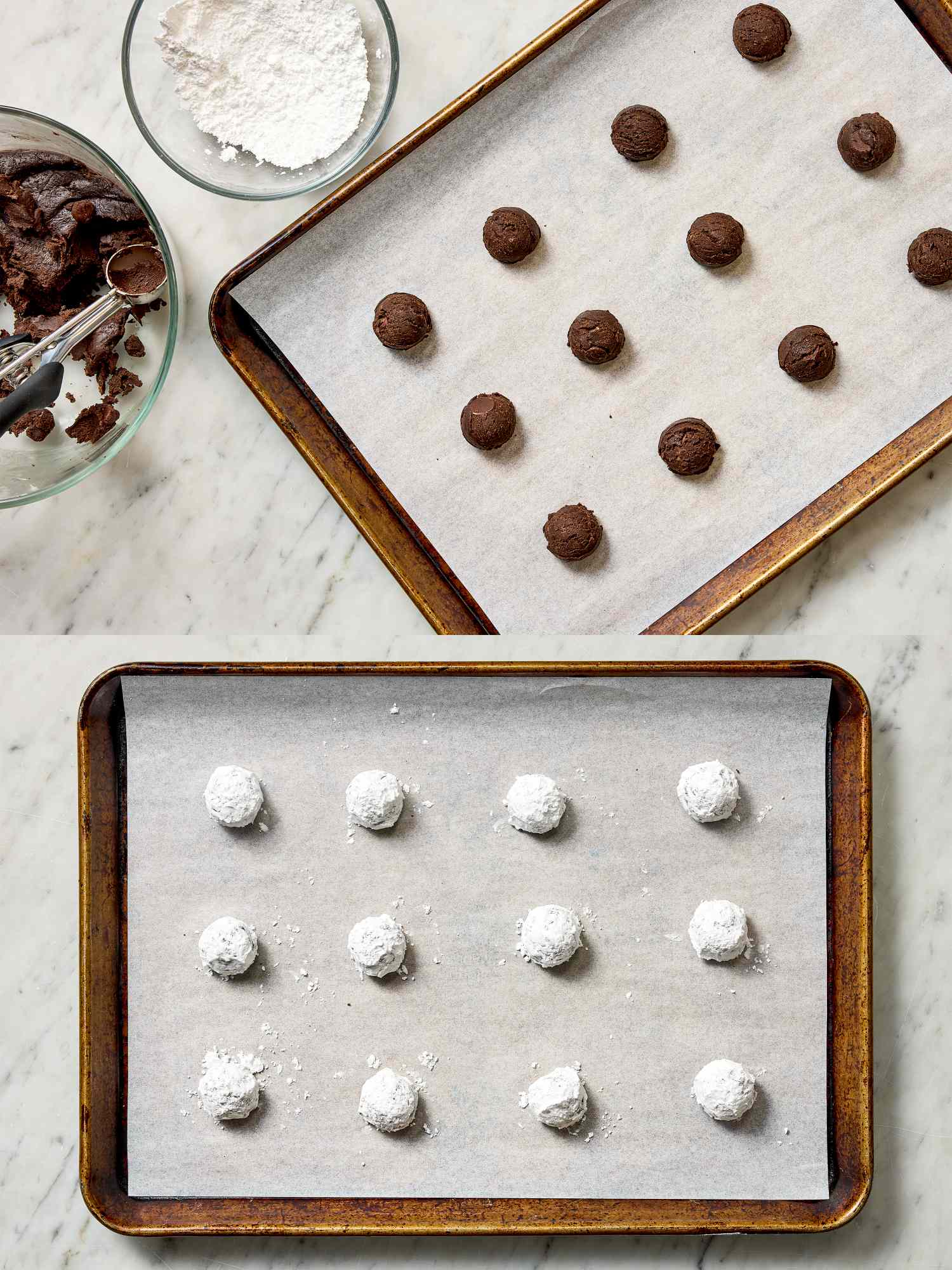 Two baking trays on a marble surface the top tray has unbaked chocolate dough balls and the bottom tray contains the same covered in powdered sugar