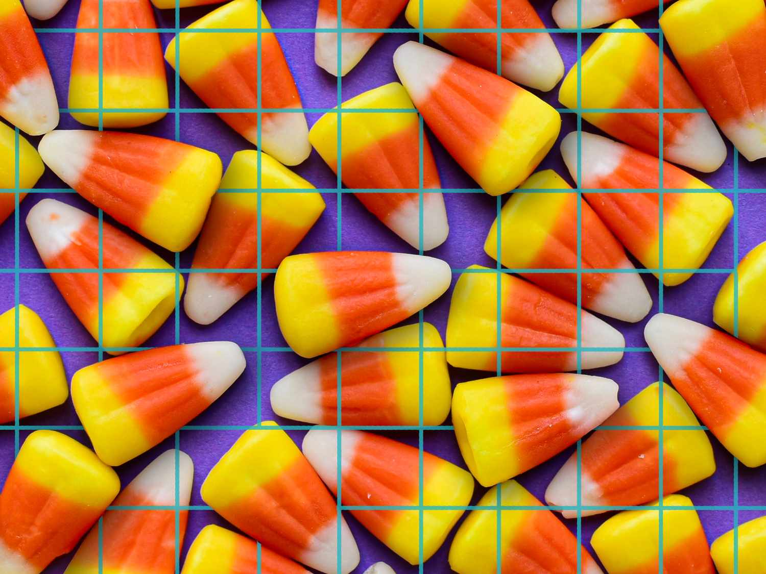 Pattern of candy corn on a purple grid background