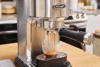 A shot of espresso is made using the De'Longhi EC900M Dedica Maestro Espresso Machine