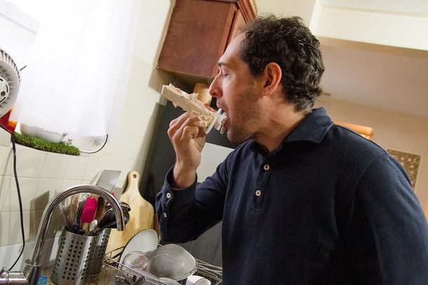 Daniel Gritzer licking freshly churn ice cream. 