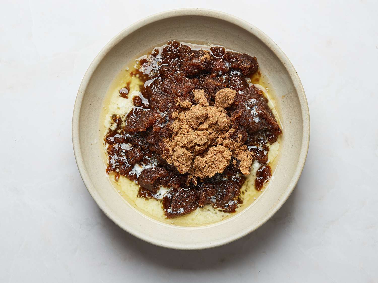 Bowl of melted butter and brown sugar in a bowl 