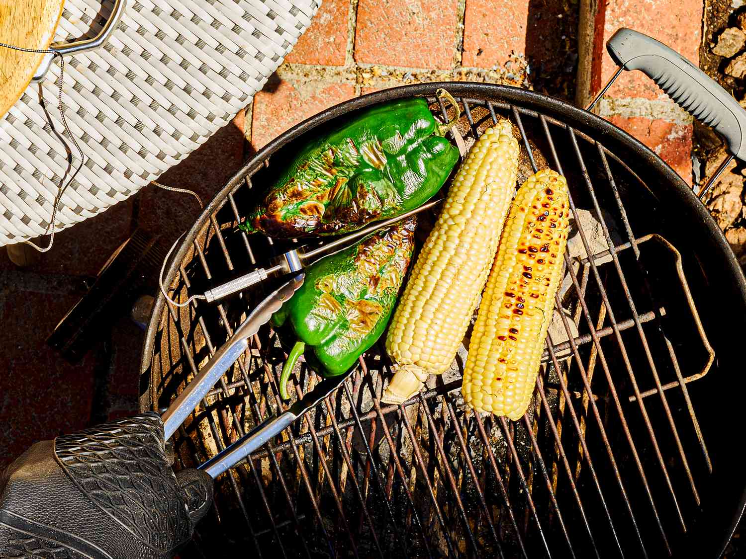 Roasting poblano and corn on grill