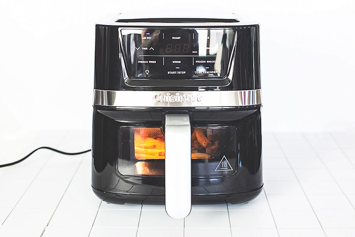 Digital air fryer with a cooking window illustrating food inside