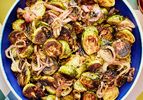 Roasted Brussels sprouts and shallots with a balsamic glaze in a bowl