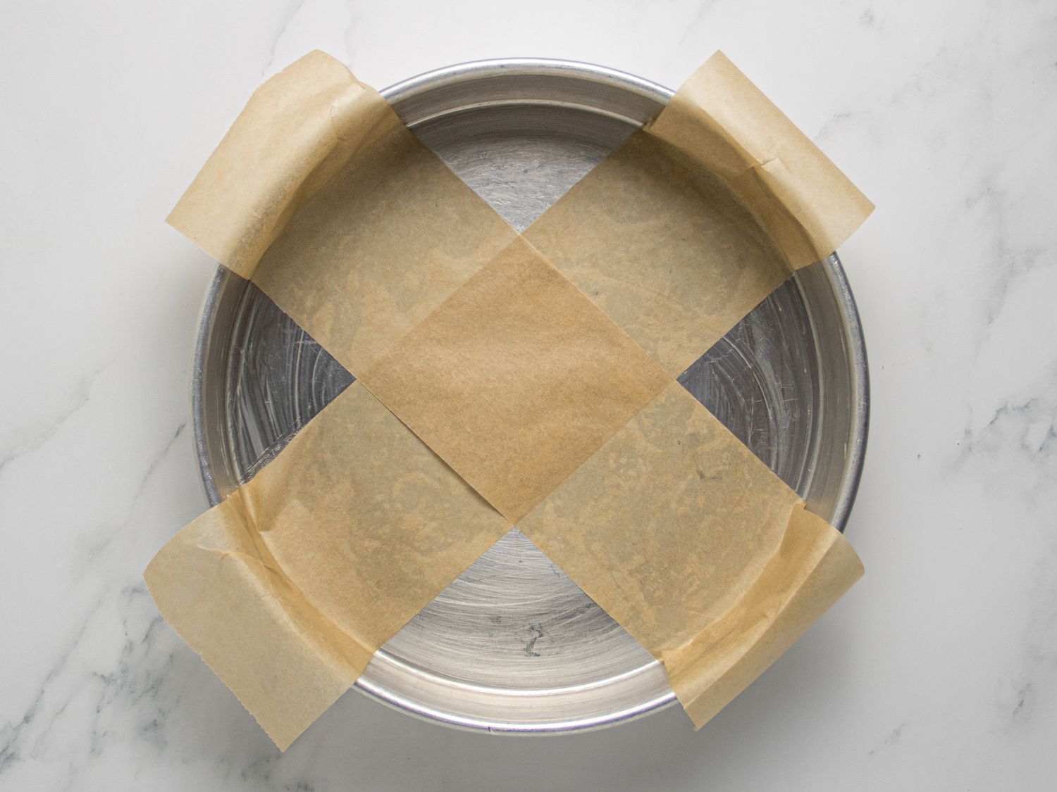 prepared baking pan on marble surface 