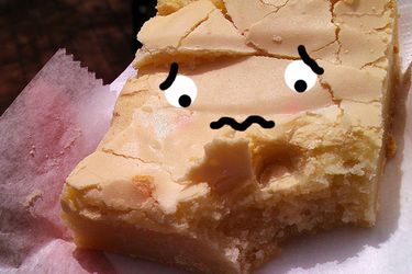 Square of Philadelphia butter cake with cartoon face