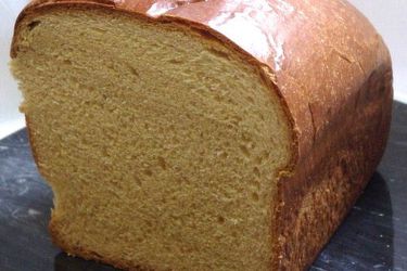 A loaf of babcia bread that's been cut in half. 