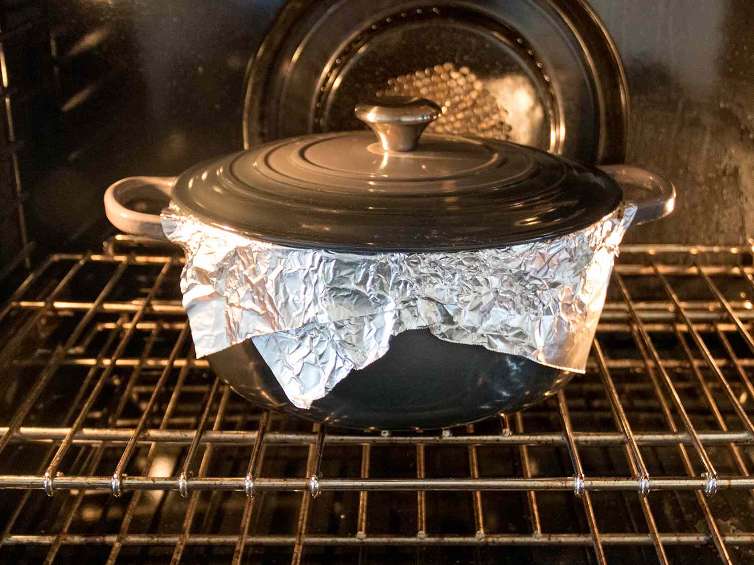 Sealed Dutch oven inside an oven.