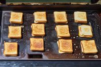 Grilled cheese are cooked on the Traeger Flatrock Flat Top Grill