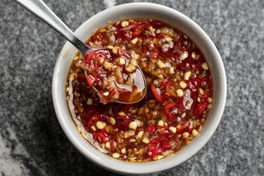 Thai-style sweet chili dipping sauce in a bowl with a spoon