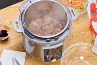 Steaming chunks of meat cook in the Instant Pot Duo Plus 8-Quart Multi-Use Pressure Cooker V4