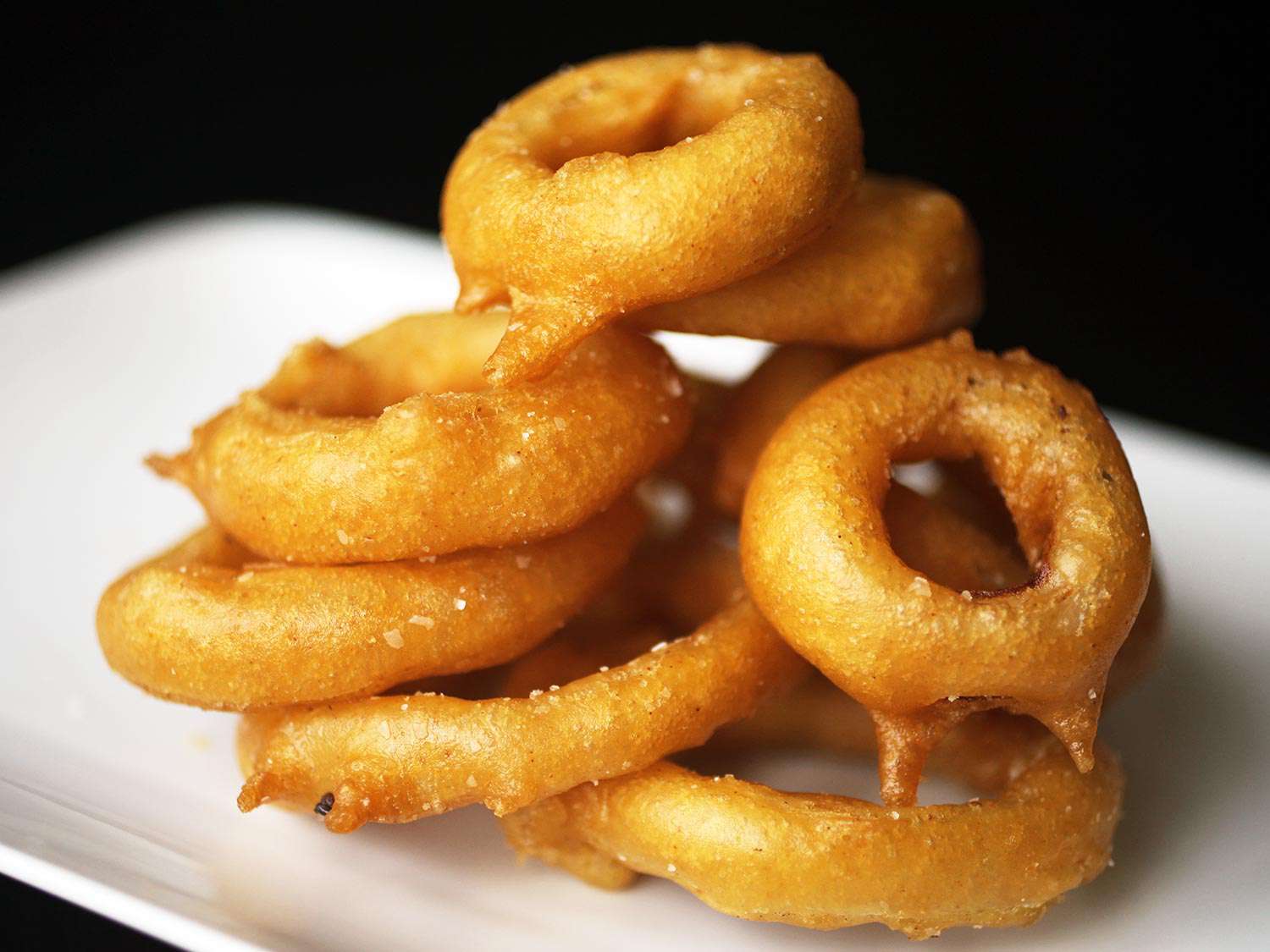 A pile of perfectly fried onion rings.