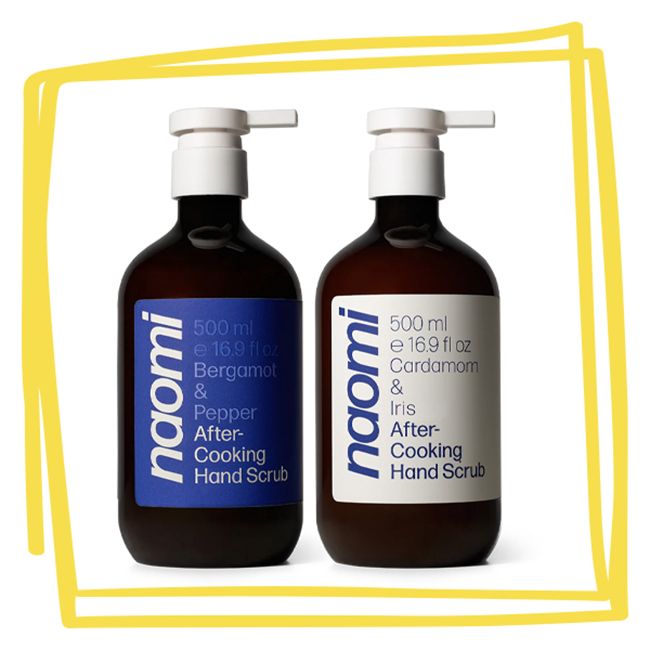 Two bottles of Naomi After Cooking Hand Scrub in brown containers with pump tops labeled Bergamot Pepper and Cardamom Iris