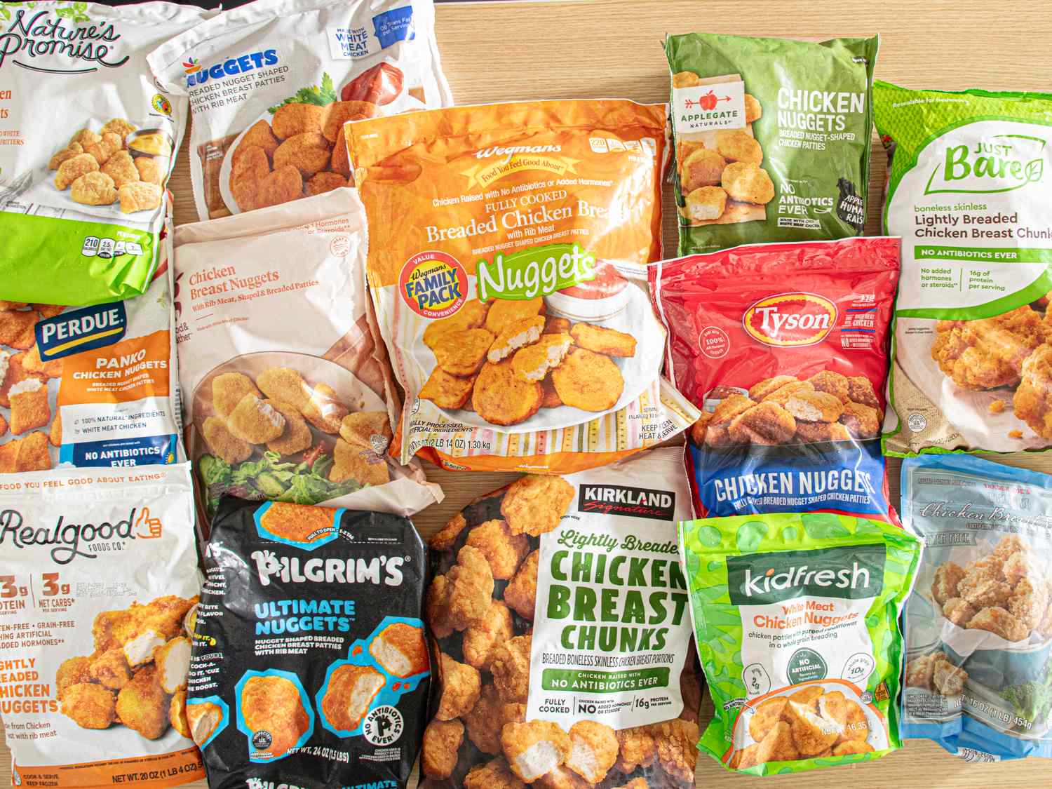 An assortment of packaged chicken nugget products displayed on a table