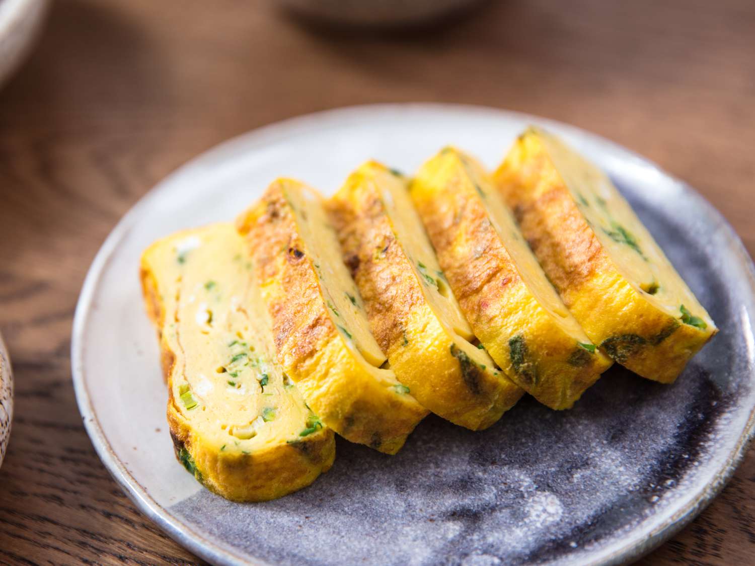 Rolled omelette banchan on a plate.