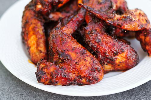 A plate of grilled sweet and spicy chicken wings.