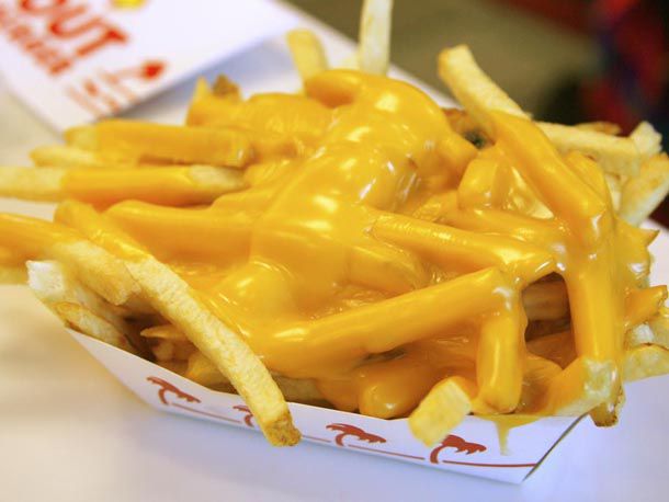 French fries that have been covered in melted cheese