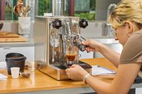 A person making espresso with the Lelit MaraX Espresso Machine PL62X-120
