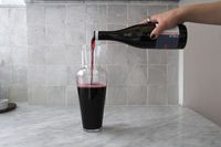 Red wine being poured into the Riedel Wine Friendly wine decanter