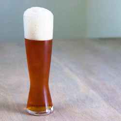 A tall glass of amber-colored bock beer.