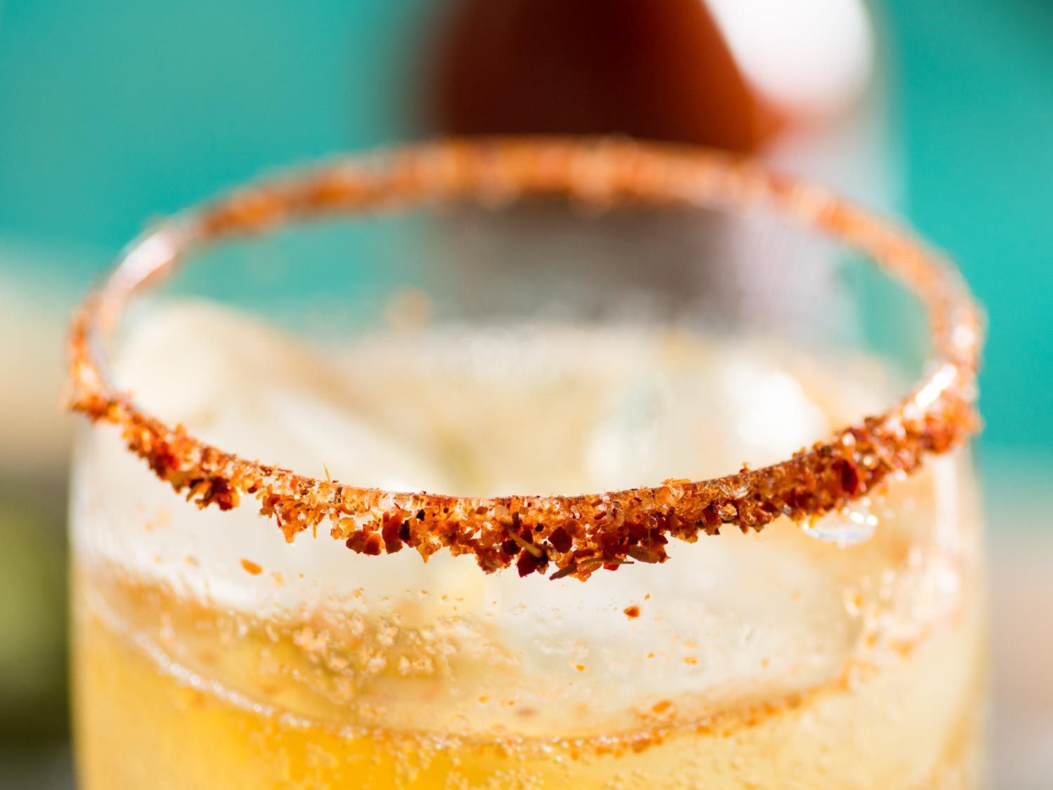 The Tajín-encrusted rim of a michelada.