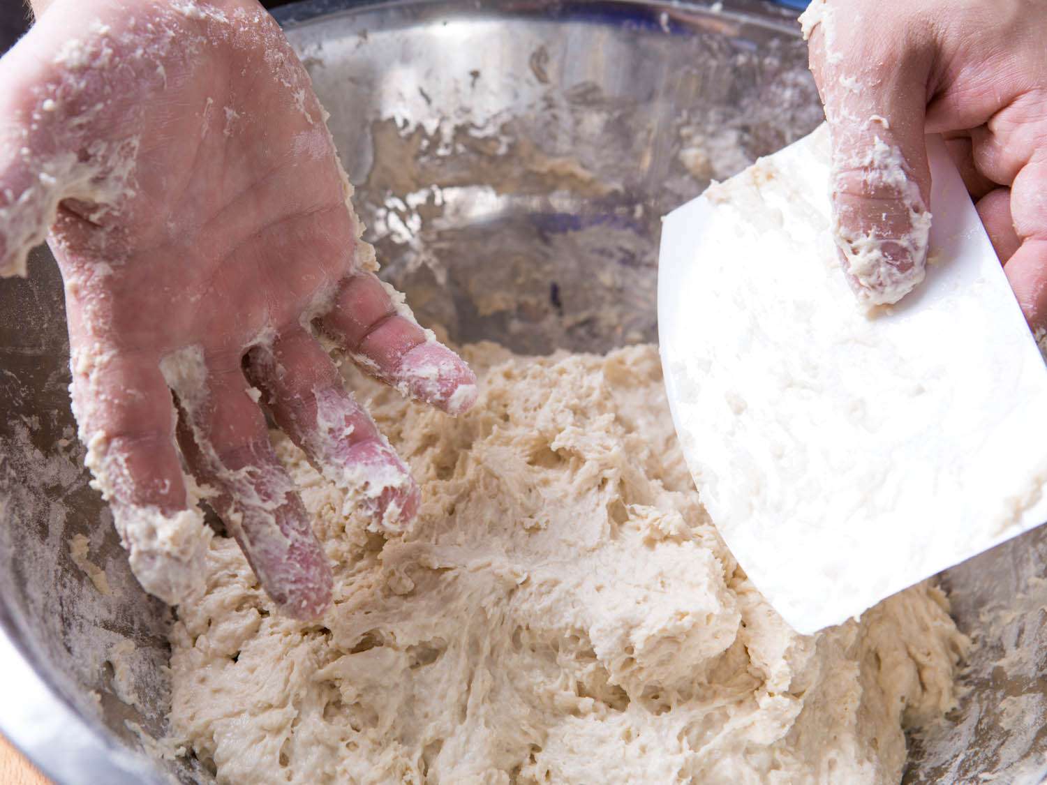 Hands covered in dough