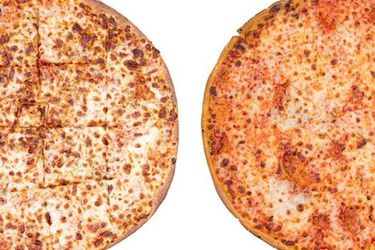 A Papa John's thin crust pizza next to a Domino's thin crust pizza. 