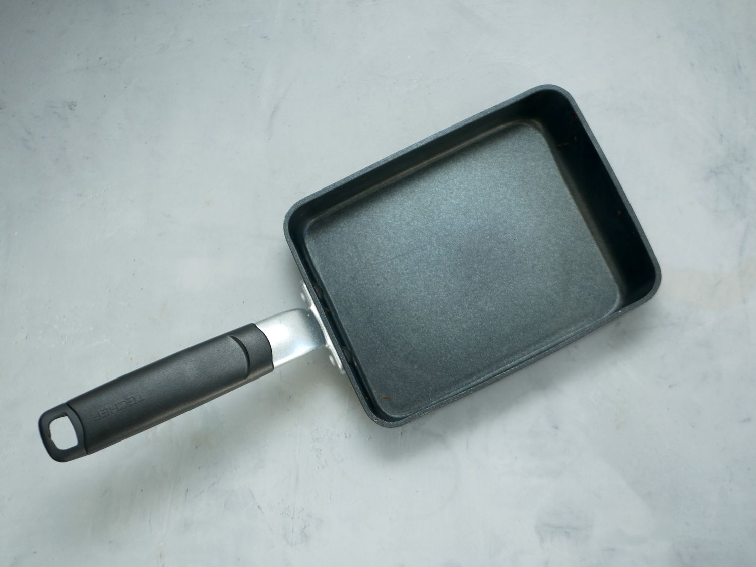 techef tamagoyaki skillet on a gray backdrop