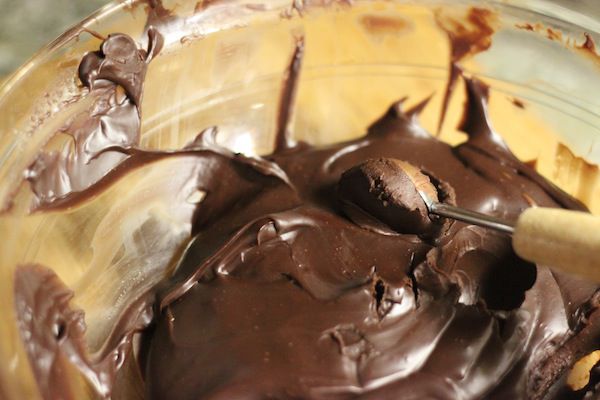 scooping set ganache with melon baller