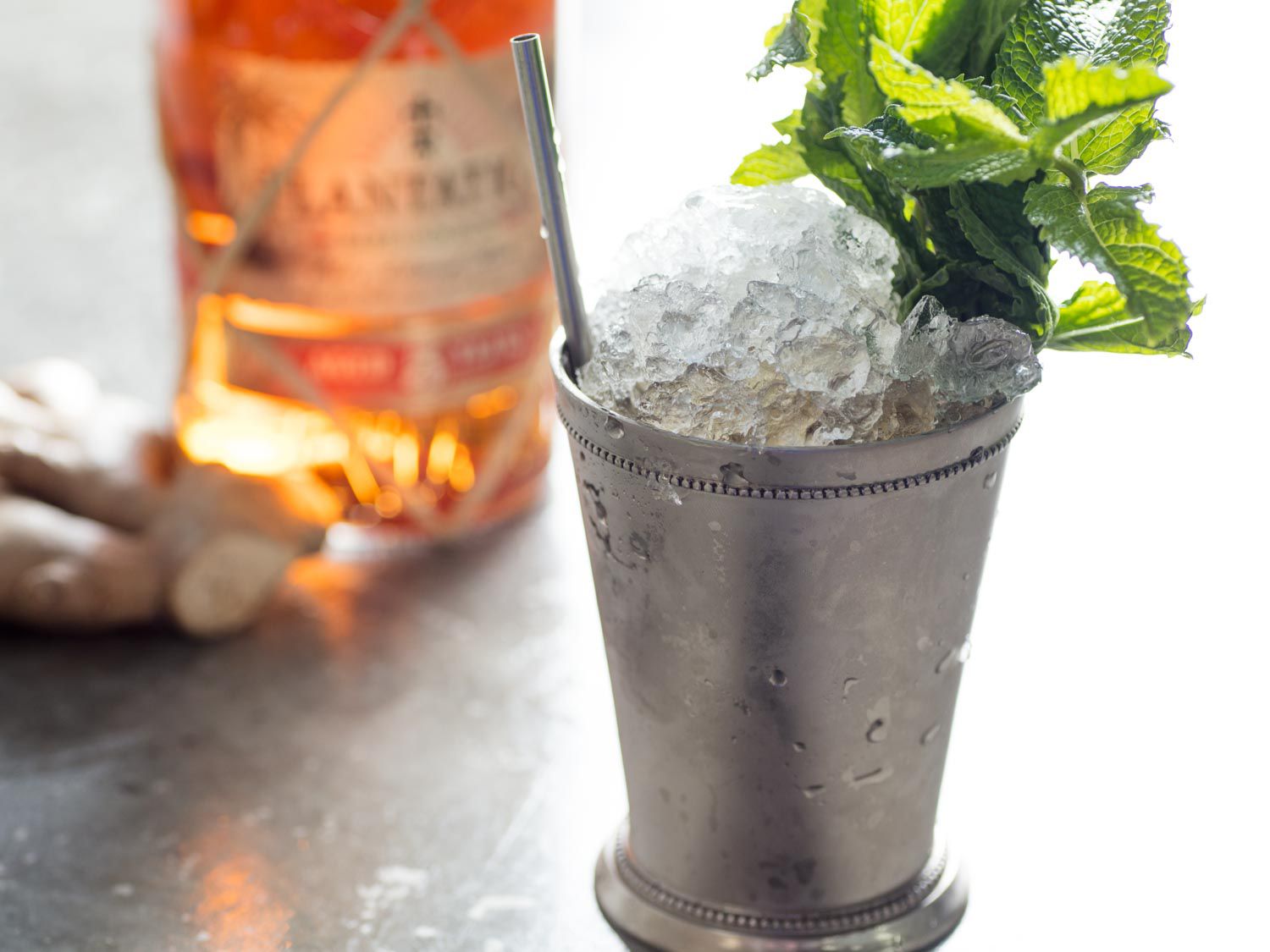 A Dark and Stormy mint julep (rum, ginger beer, mint, and maple syrup) in a frosted julep cup
