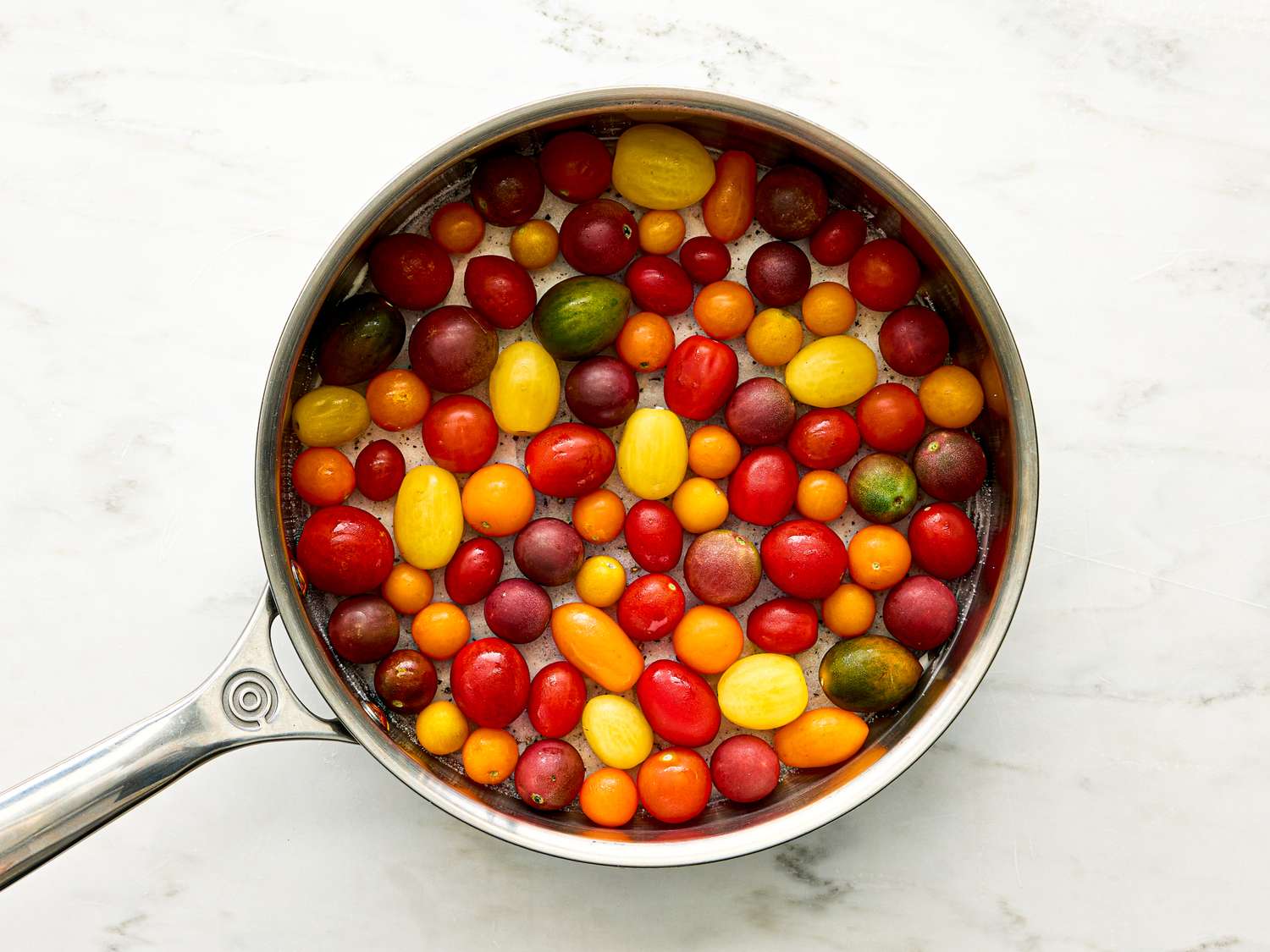 Tomatoes arranged in a pan for preparation