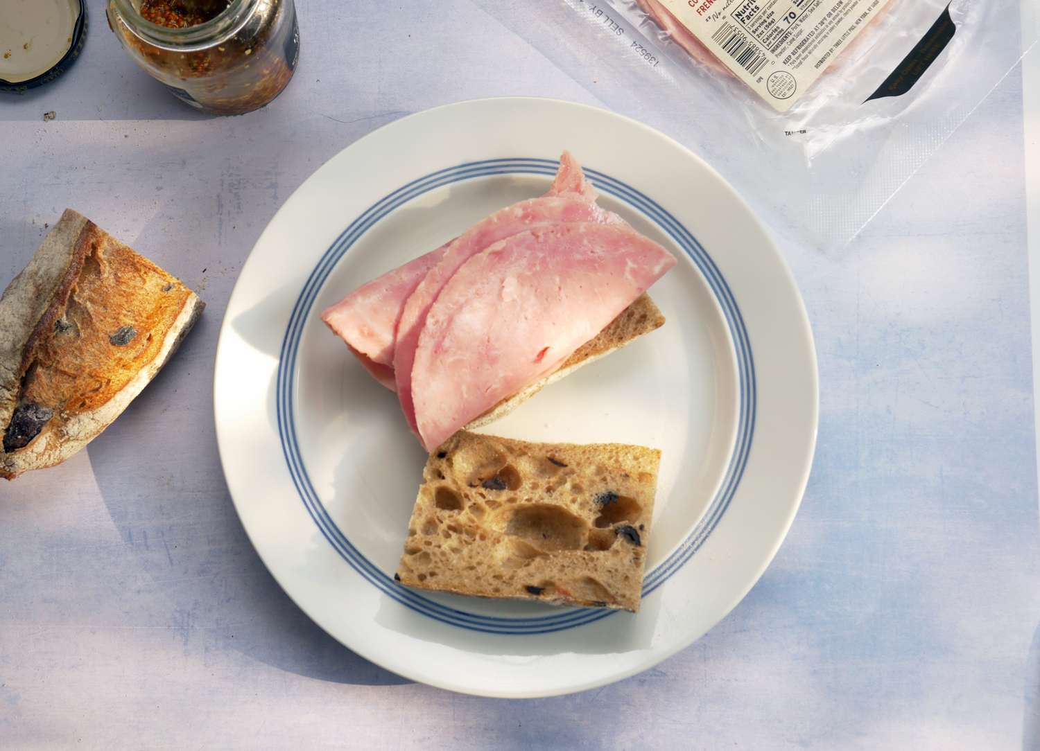 two slices of ham on a piece of bread