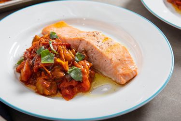 Salmon alongside a tomato eggplant stew, all made on a sheet-pan