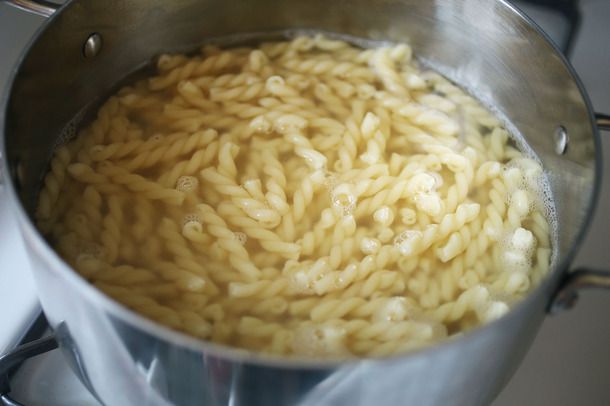 A pot containing pasta in water. 