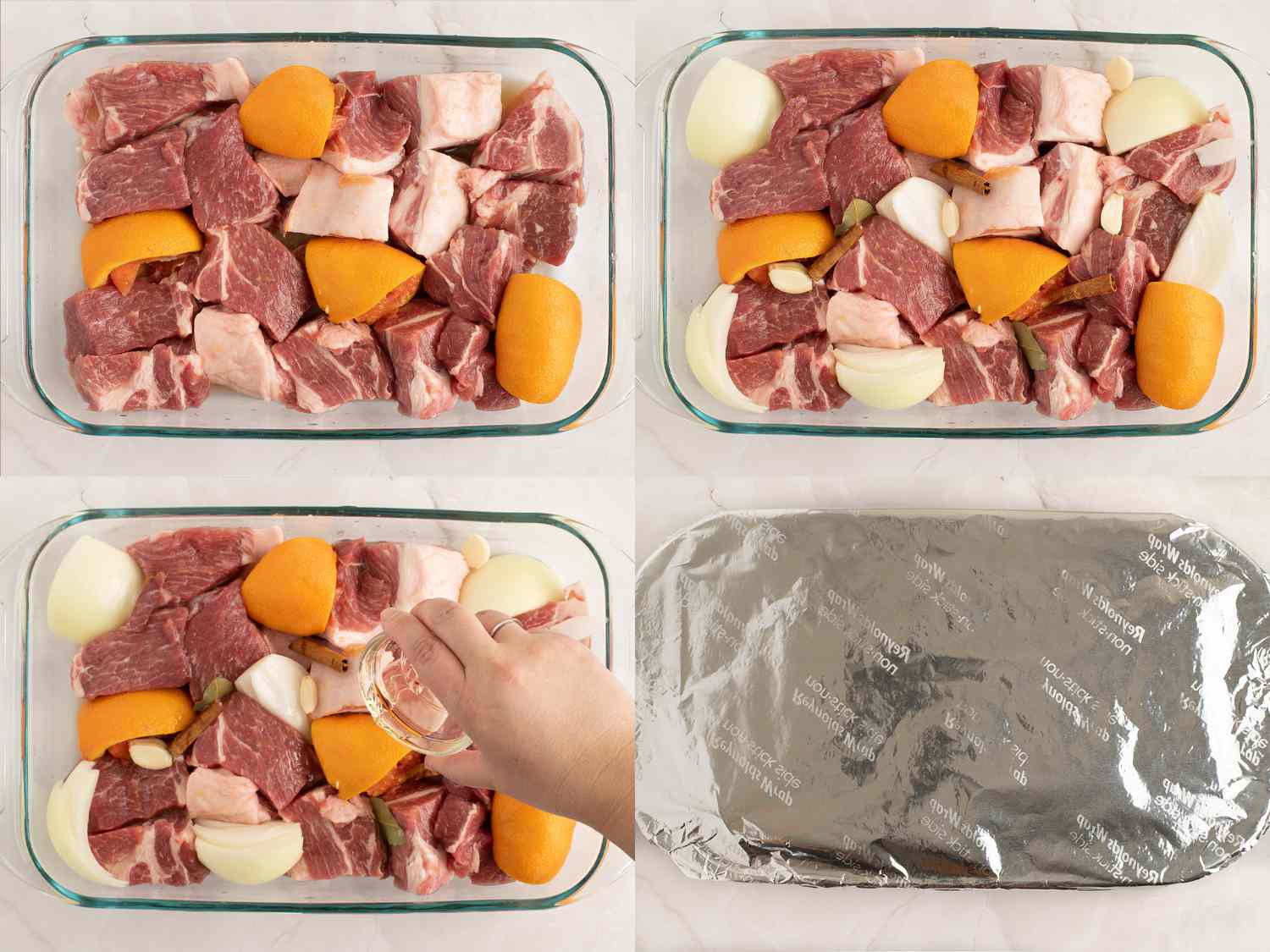 Cubes of pork in a dish with onions, oranges, and seasonings