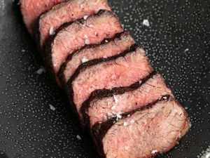 close up of grilled short ribs cut into slices