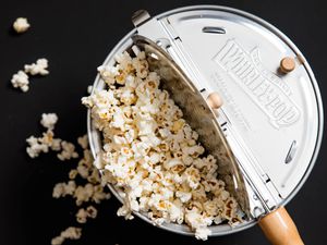 an overhead shot of a Whirley Pop filled with popcorn