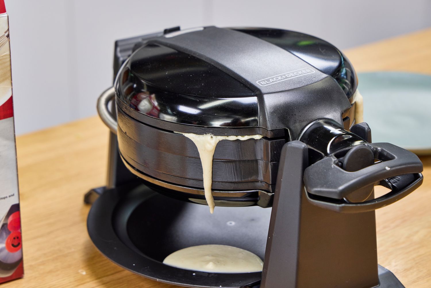 Batter drips from the Black+Decker Double Flip Rotating Waffle Maker