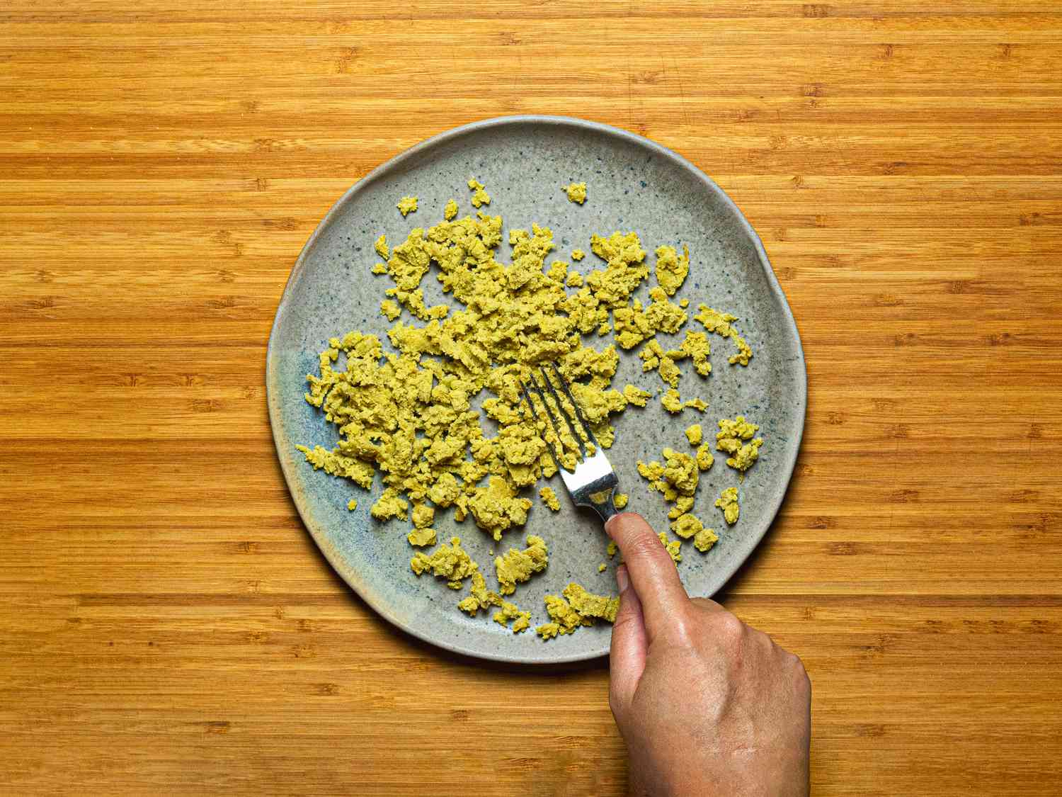 Overhead view of smashing the sweet potatoes 