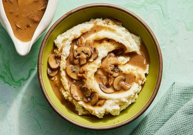 Overhead view of mushroom gravy poured on top of potatoes