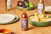 Angry Goat's Sacrifice Fire-Roasted Habanero Sauce on table