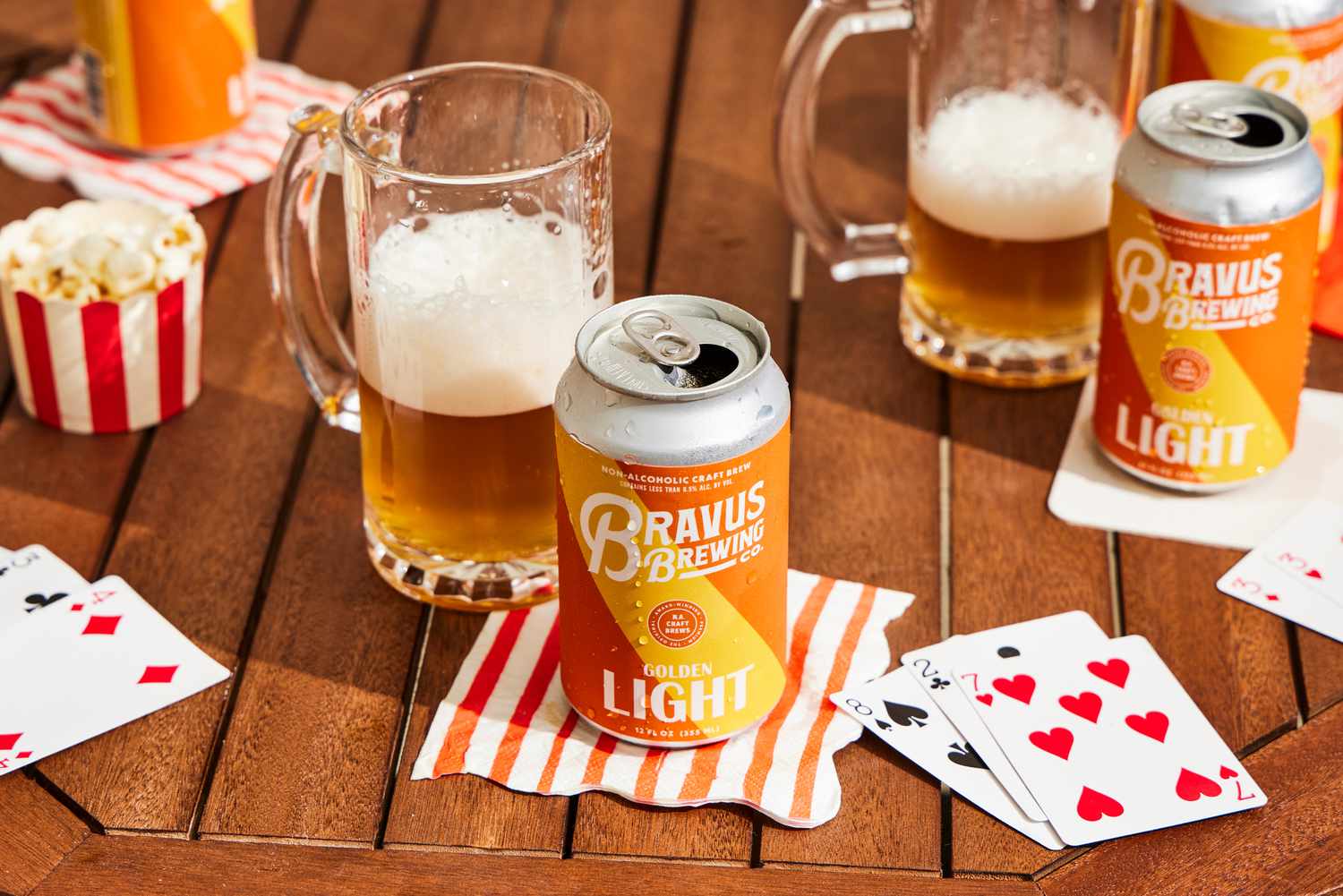 a can of bravus beer in front of a glass